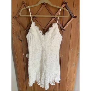 Saints + Secrets white lace sleeveless ruffled hem mini dress